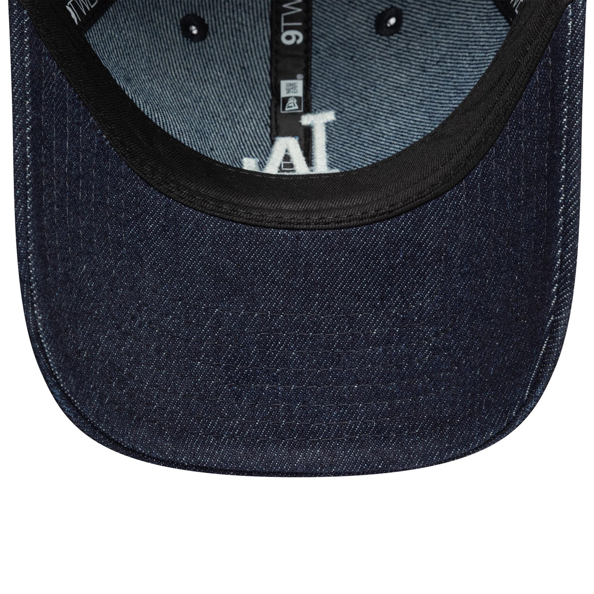 LA Dodgers Womens MLB Denim Stitch Navy New Era 9TWENTY Cap, inside view showing the black sweatband, denim undervisor, white LA logo partially beneath the crown, and contrasting blue taping with white logos.