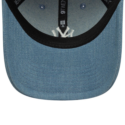 New York Yankees Womens MLB Denim Stitch Pastel Blue New Era 9TWENTY Cap, inside view showing the white embroidered NY logo set against a black sweatband, with black taping and a denim undervisor contrasting the pastel blue crown.