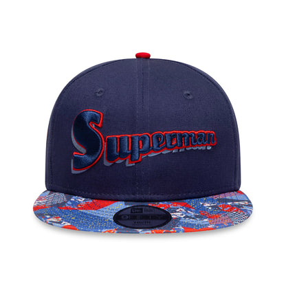 Youth DC Superman Navy New Era 9FIFTY Snapback Cap, front view showing raised Superman script logo in blue and red embroidery on the front panel, and a print on the flat visor with a 9FIFTY size sticker.
