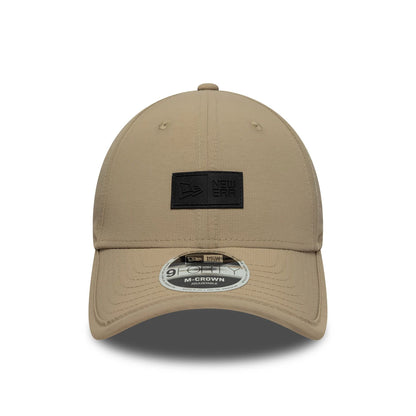 Pictured is this New Era Sport 9FORTY M-Crown in light beige. 2