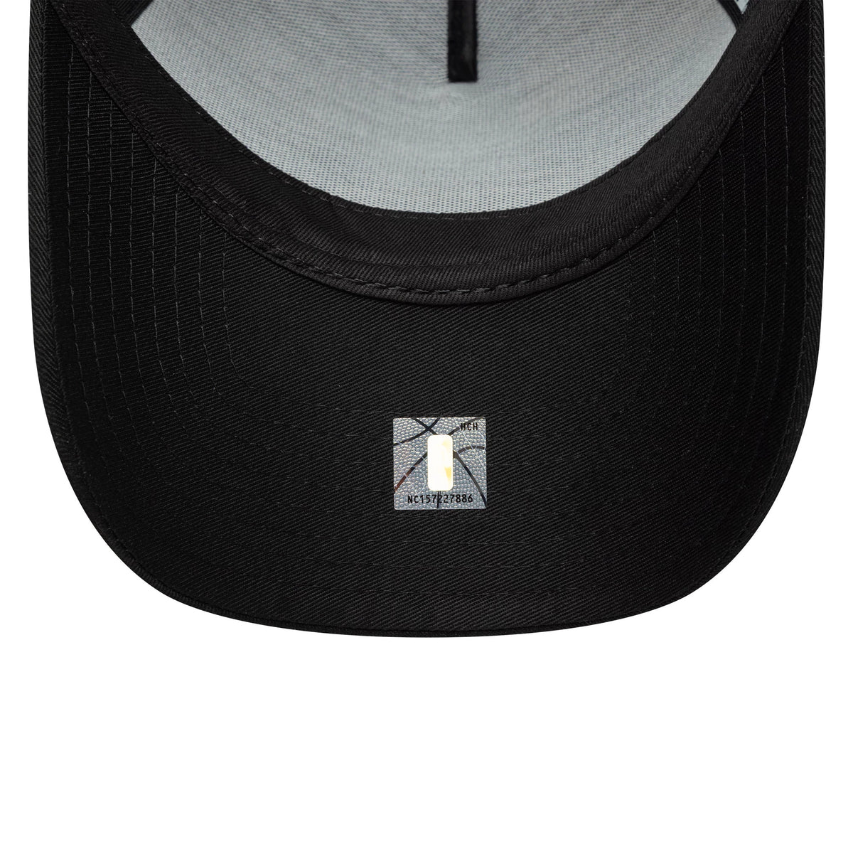 Chicago Bulls NBA Metallic Black New Era 9FORTY E-Frame Cap, inside view showing the grey sweatband, black taping across the interior seams, and a small sticker on the black undervisor near the edge.
