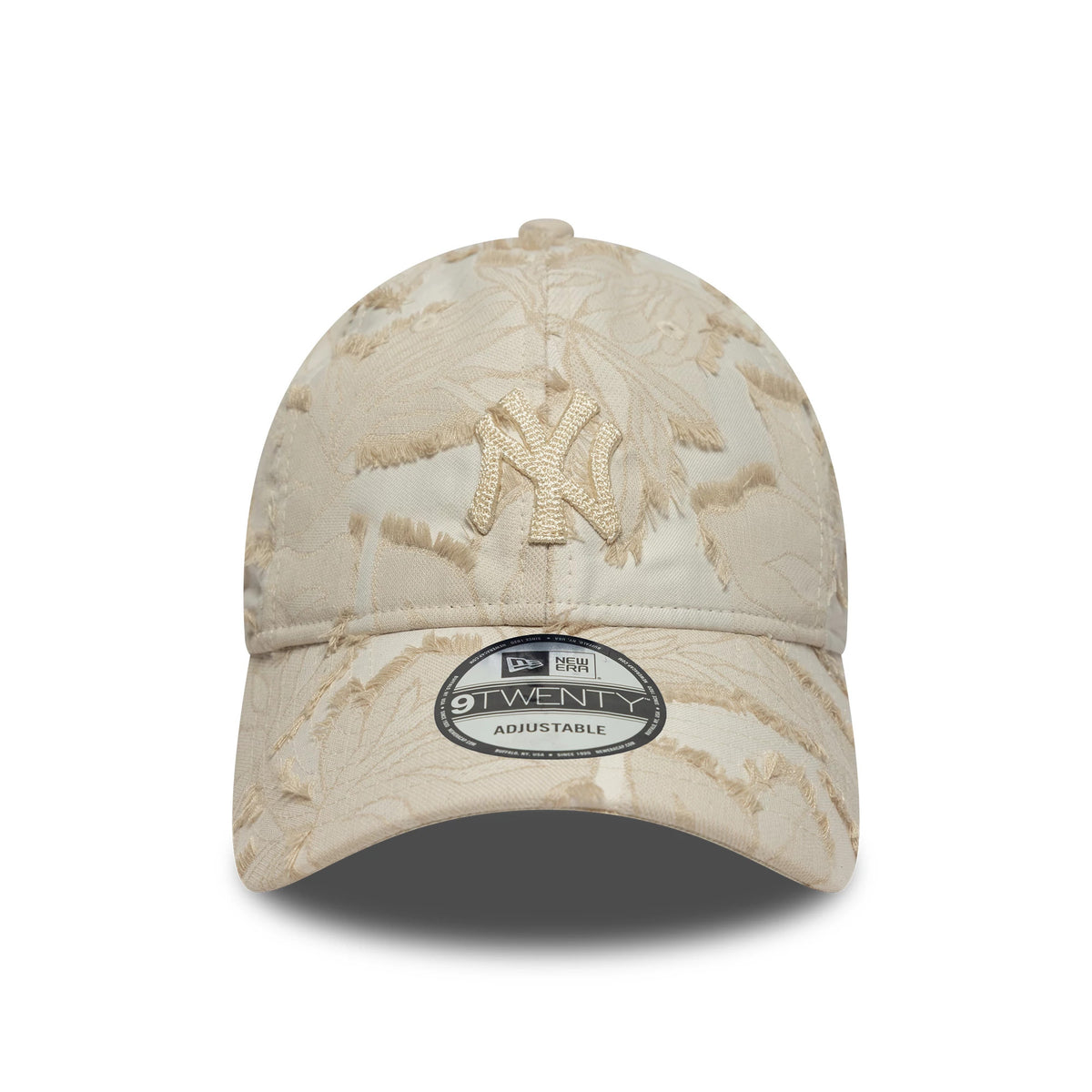 New York Yankees MLB Floral Cream New Era 9TWENTY Adjustable Cap, front view showing the beige embroidered Yankees logo on the floral-patterned cream fabric, with a 9TWENTY size sticker on the curved visor.