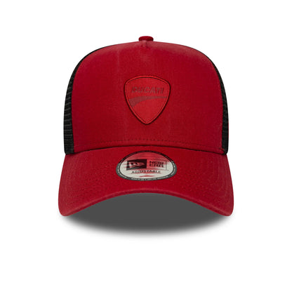 Ducati Motor Logo Dark Red New Era 9FORTY E-Frame Trucker Cap, front view showing the raised embroidered Ducati shield logo on the red front panel, with a black mesh back and a 9FORTY size sticker on the red curved visor.