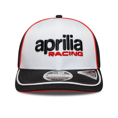 Pictured is this Aprilia Logo 9SEVENTY Stretch Snap in white. 2