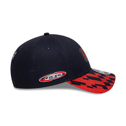 Red Bull Racing Visor Print Dark Blue New Era 9FORTY M-Crown Cap, side view showing the embroidered New Era Racing logo on the left side and a red and black chequered pattern on the visor with a 9FORTY size sticker.