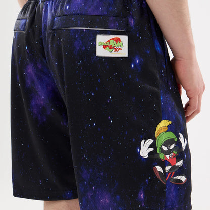 The model is wearing this Warner Brothers Space Jam Oversized Shorts in white. 7