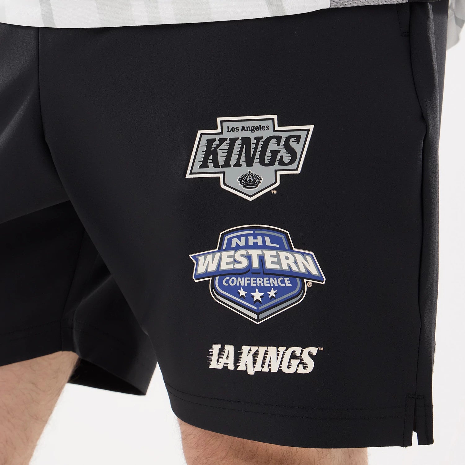 The model is wearing this NHL Match LA Kings Oversized Shorts in black. 3