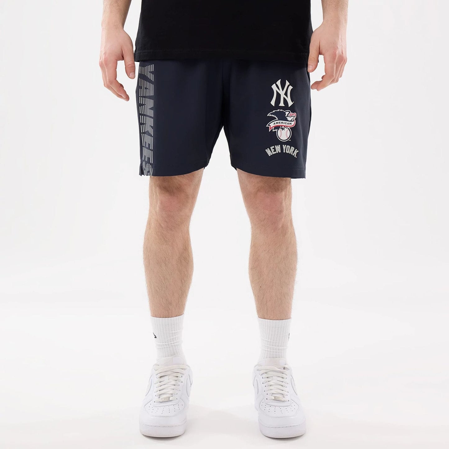 The model is wearing this MLB Match New York Yankees Oversized Shorts in navy. 1