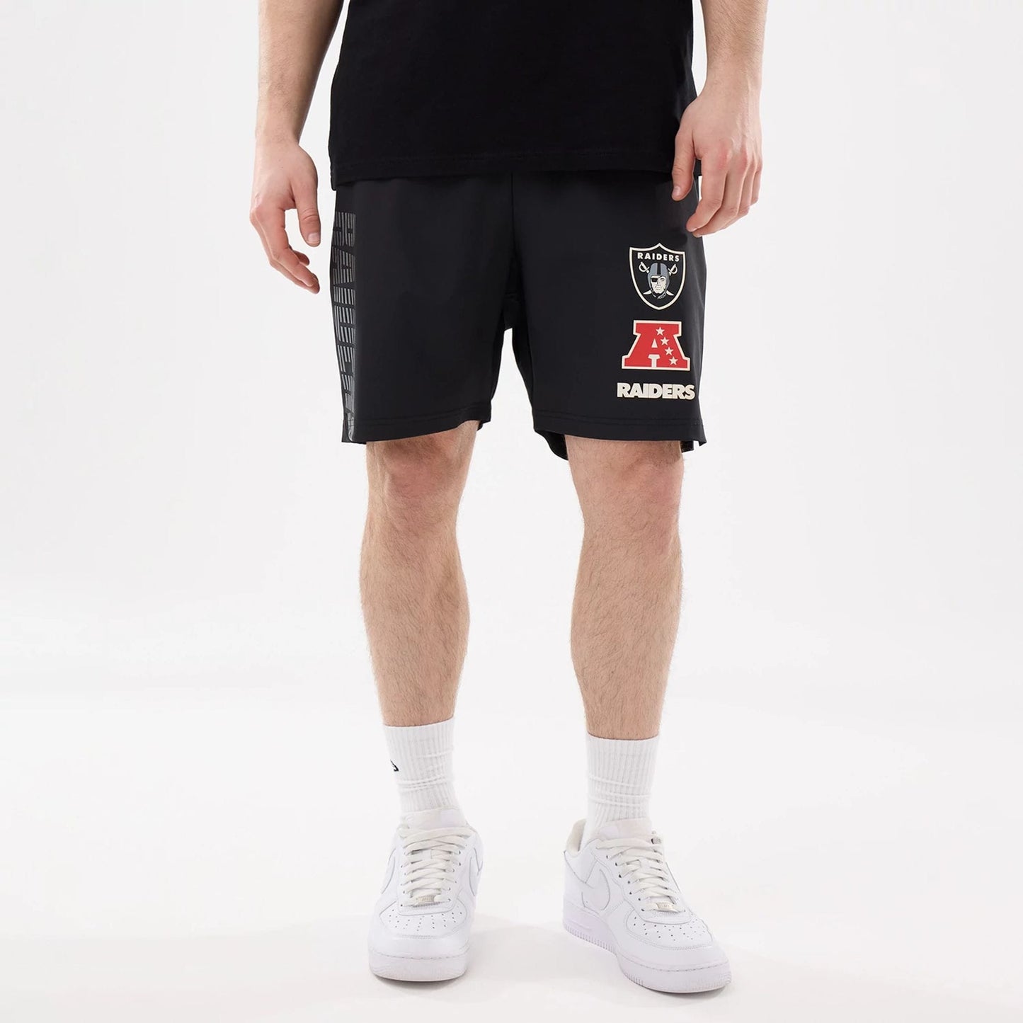 The model is wearing this NFL Match Las Vegas Raiders Oversized Shorts in black. 5