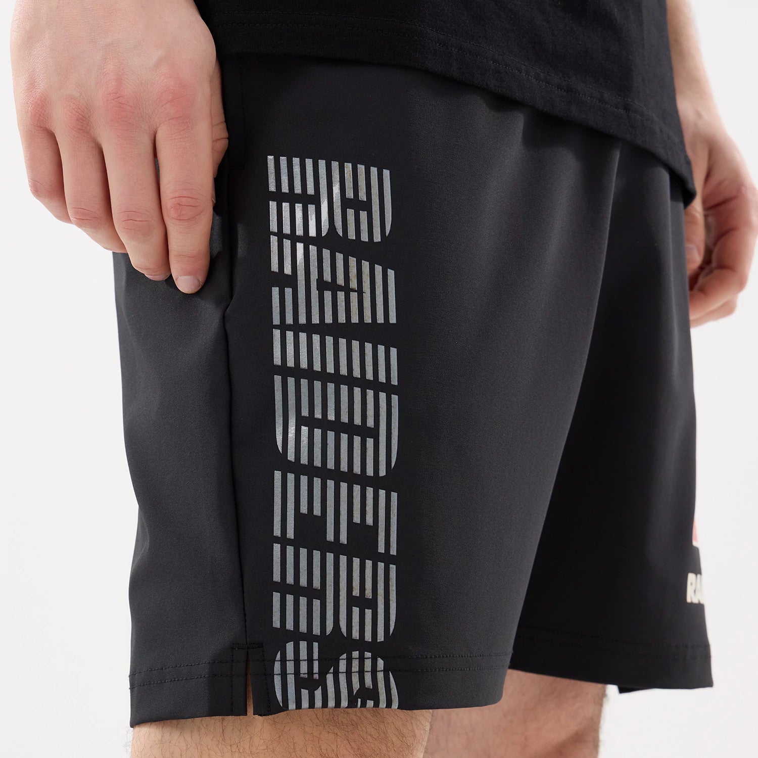 The model is wearing this NFL Match Las Vegas Raiders Oversized Shorts in black. 4