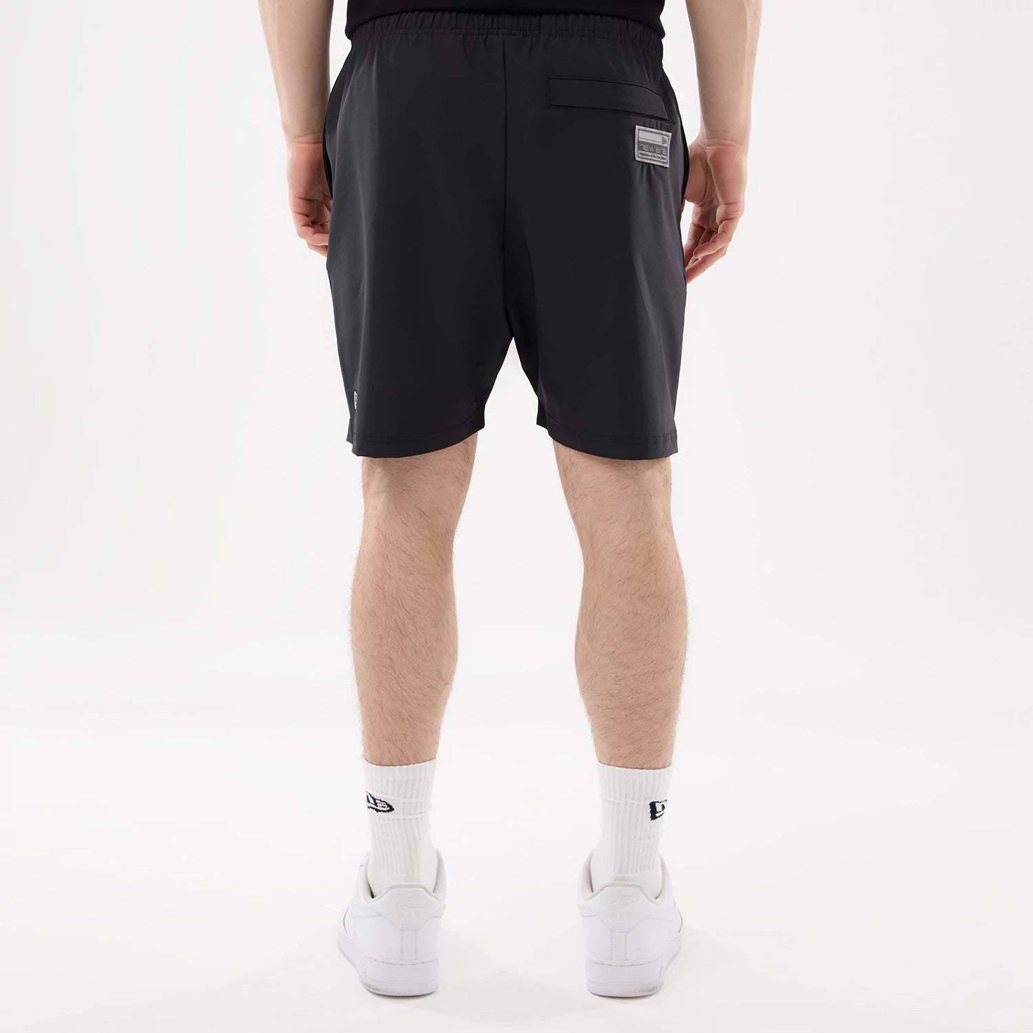 The model is wearing this NFL Match Las Vegas Raiders Oversized Shorts in black. 2