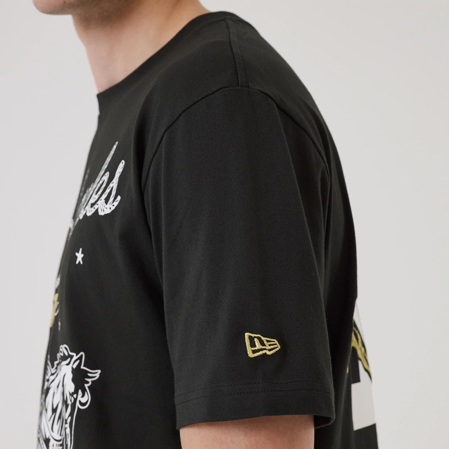 The model is wearing this MLB Cowboy Graphic LA Dodgers T-Shirt in black. 6