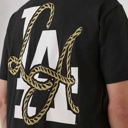 The model is wearing this MLB Cowboy Graphic LA Dodgers T-Shirt in black. 4