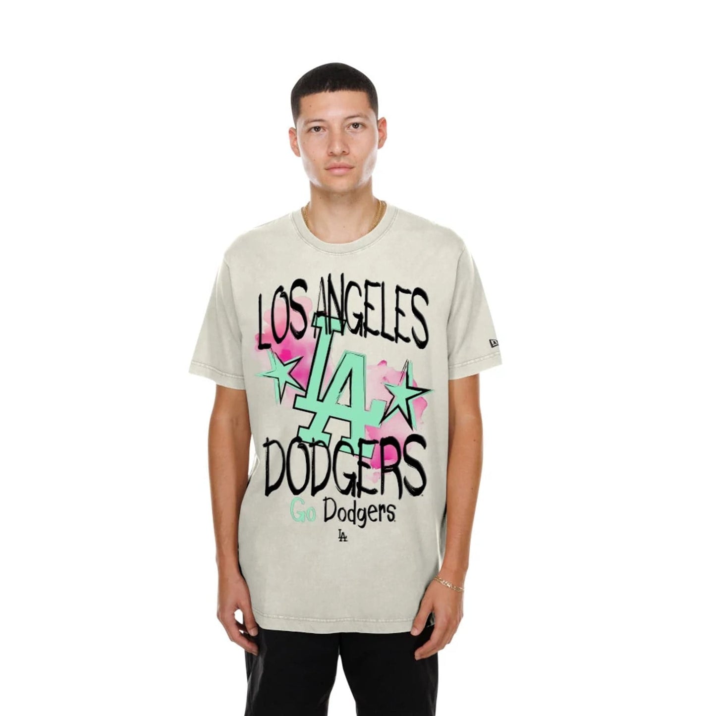 The model is wearing this MLB Street Art Graphic LA Dodgers T-Shirt in light beige. 1