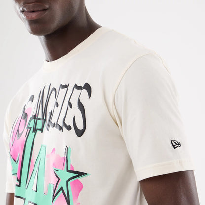 The model is wearing this MLB Street Art Graphic LA Dodgers T-Shirt in light beige. 5