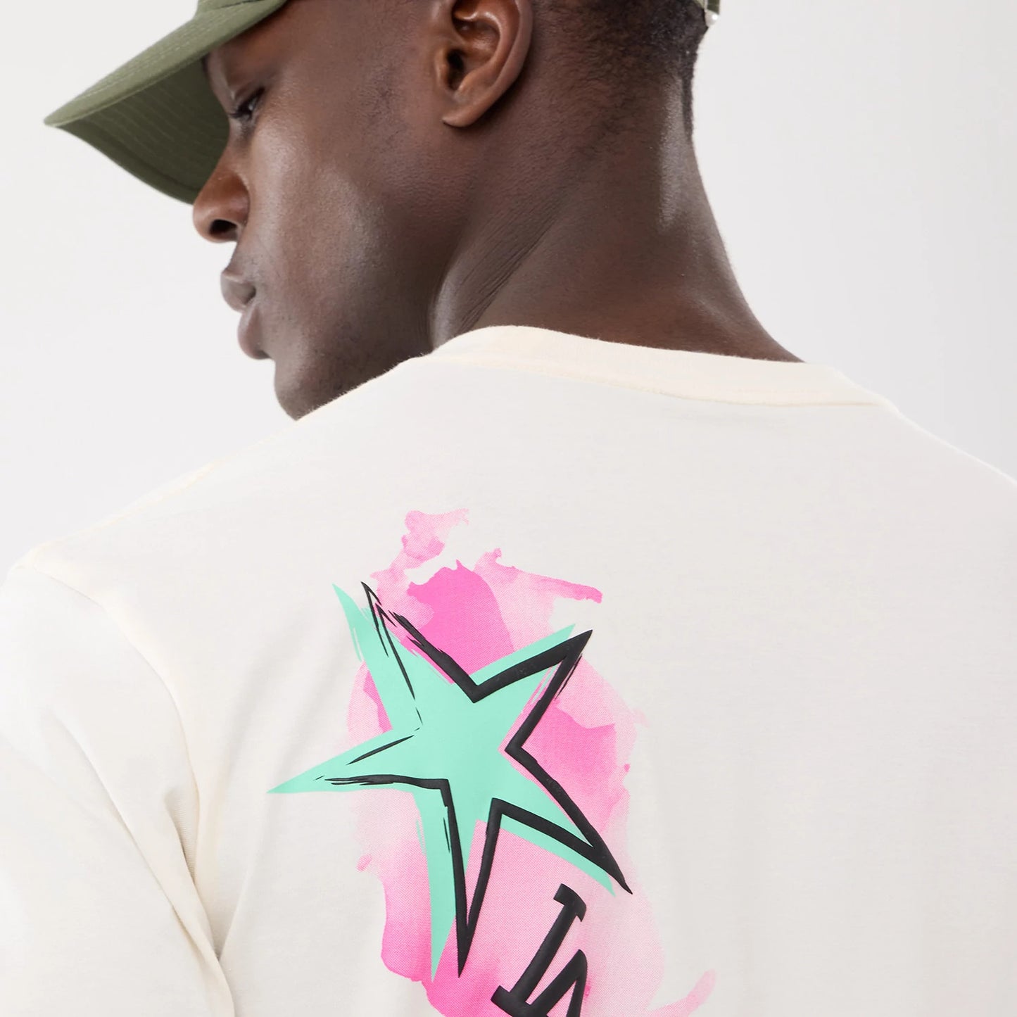 The model is wearing this MLB Street Art Graphic LA Dodgers T-Shirt in light beige. 6