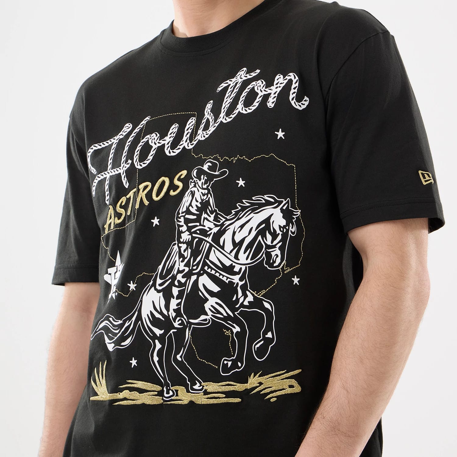 The model is wearing this MLB Cowboy Graphic Houston Astros T-Shirt in black. 3