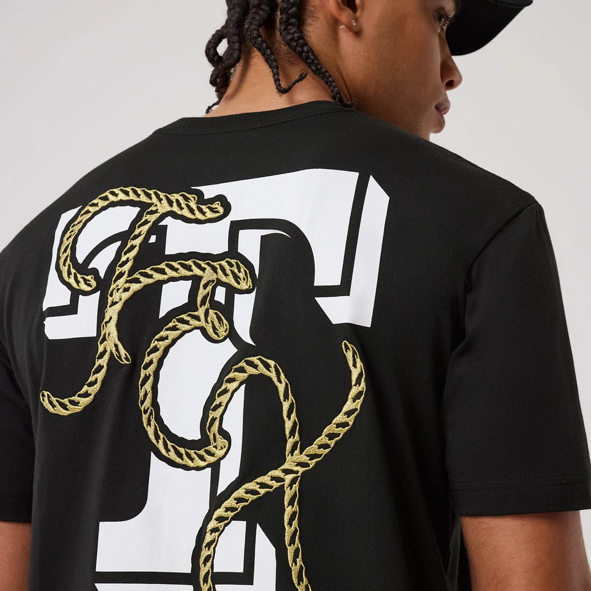 The model is wearing this MLB Cowboy Graphic Texas Rangers T-Shirt in black. 4