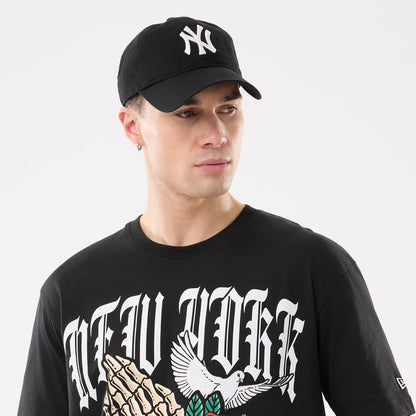 The model is wearing this MLB Script Graphic New York Yankees T-Shirt in black. 6