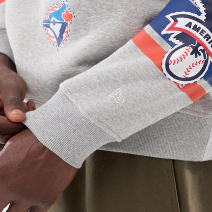 The model is wearing this MLB Sport Classic Toronto Blue Jays Crew Neck Sweater in grey. 3