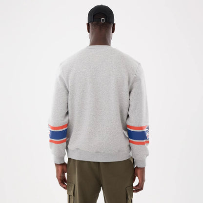 The model is wearing this MLB Sport Classic Toronto Blue Jays Crew Neck Sweater in grey. 2