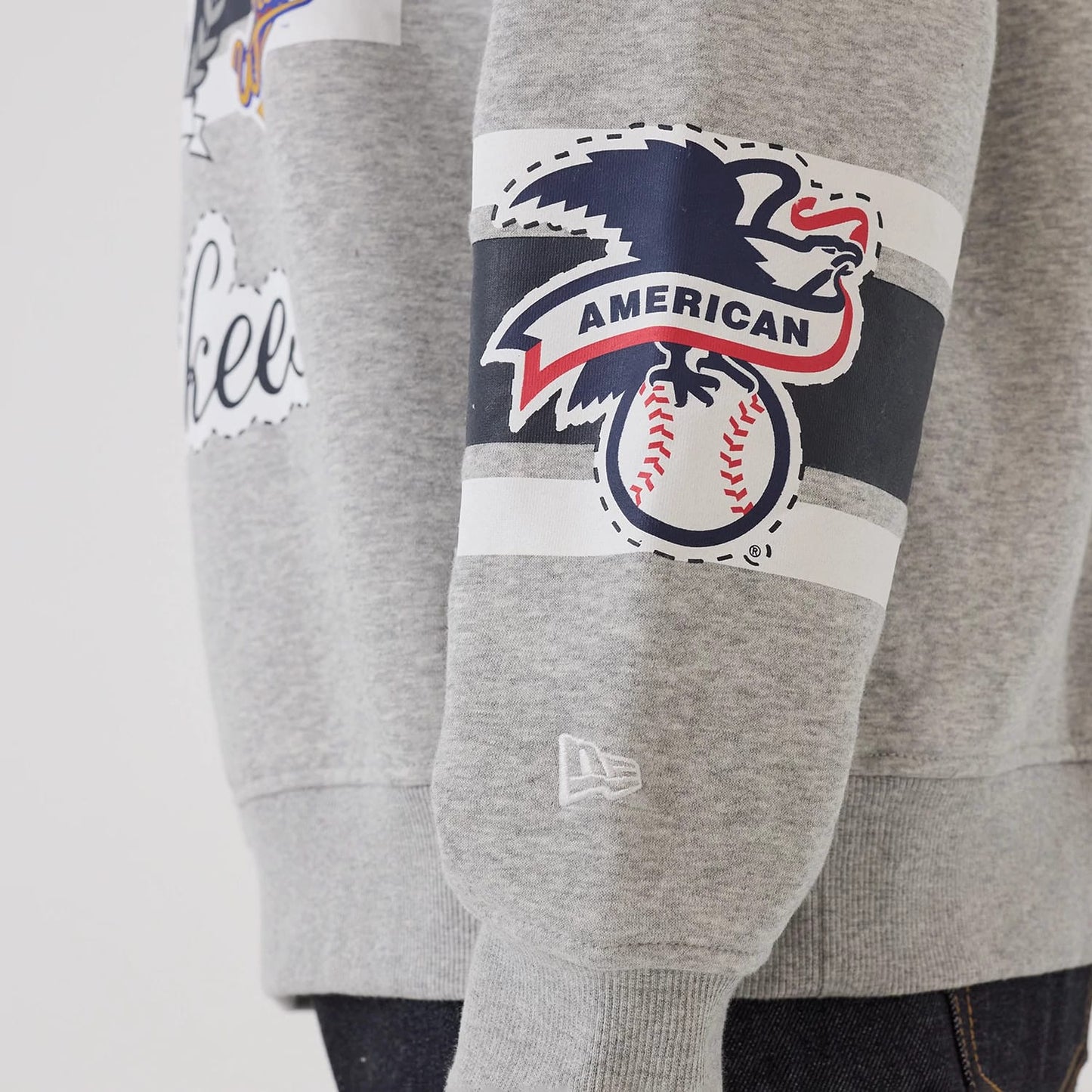 The model is wearing this MLB Sport Classic New York Yankees Crew Neck Sweater in grey. 5