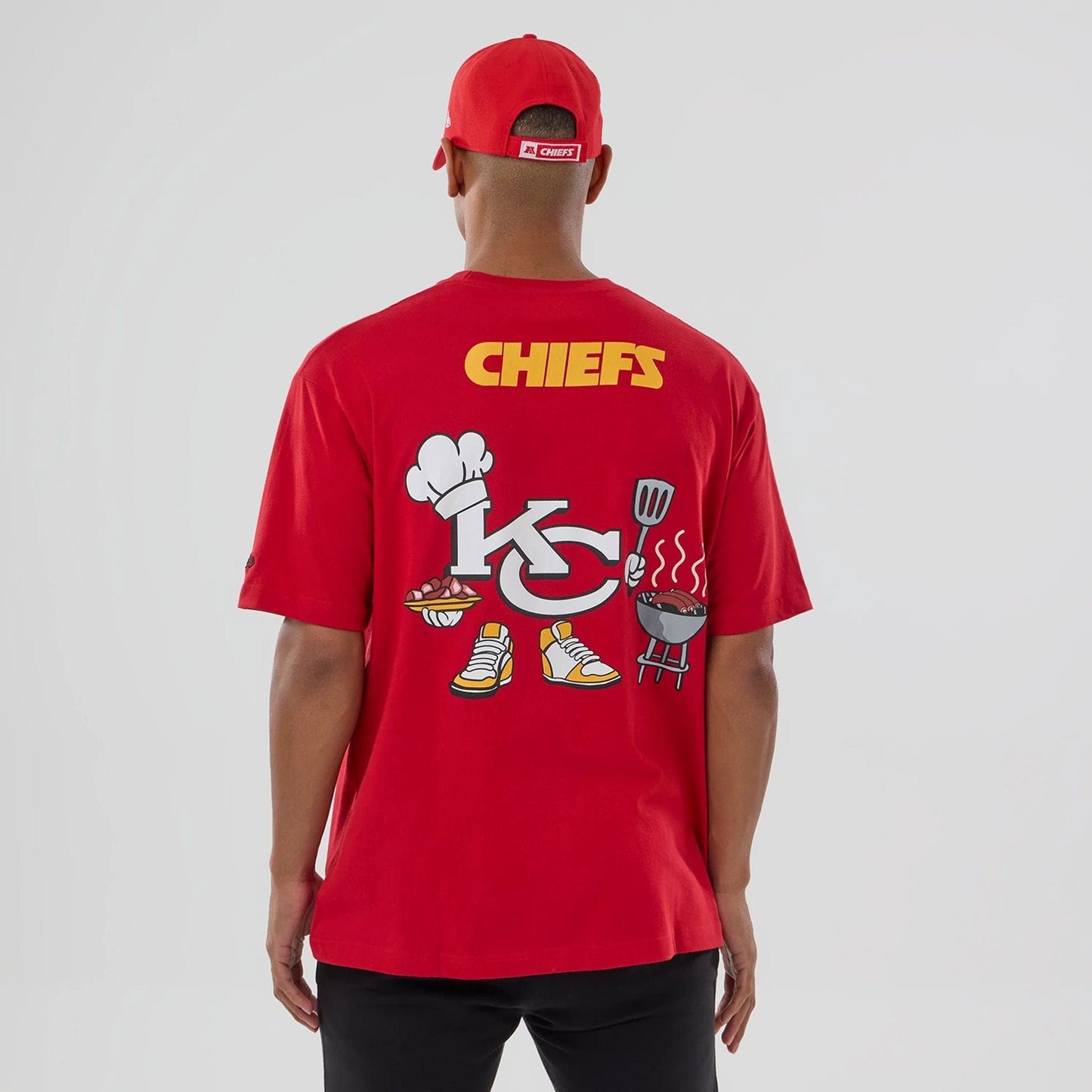The model is wearing this NFL Graphic Kansas City Chiefs T-Shirt in red. 2