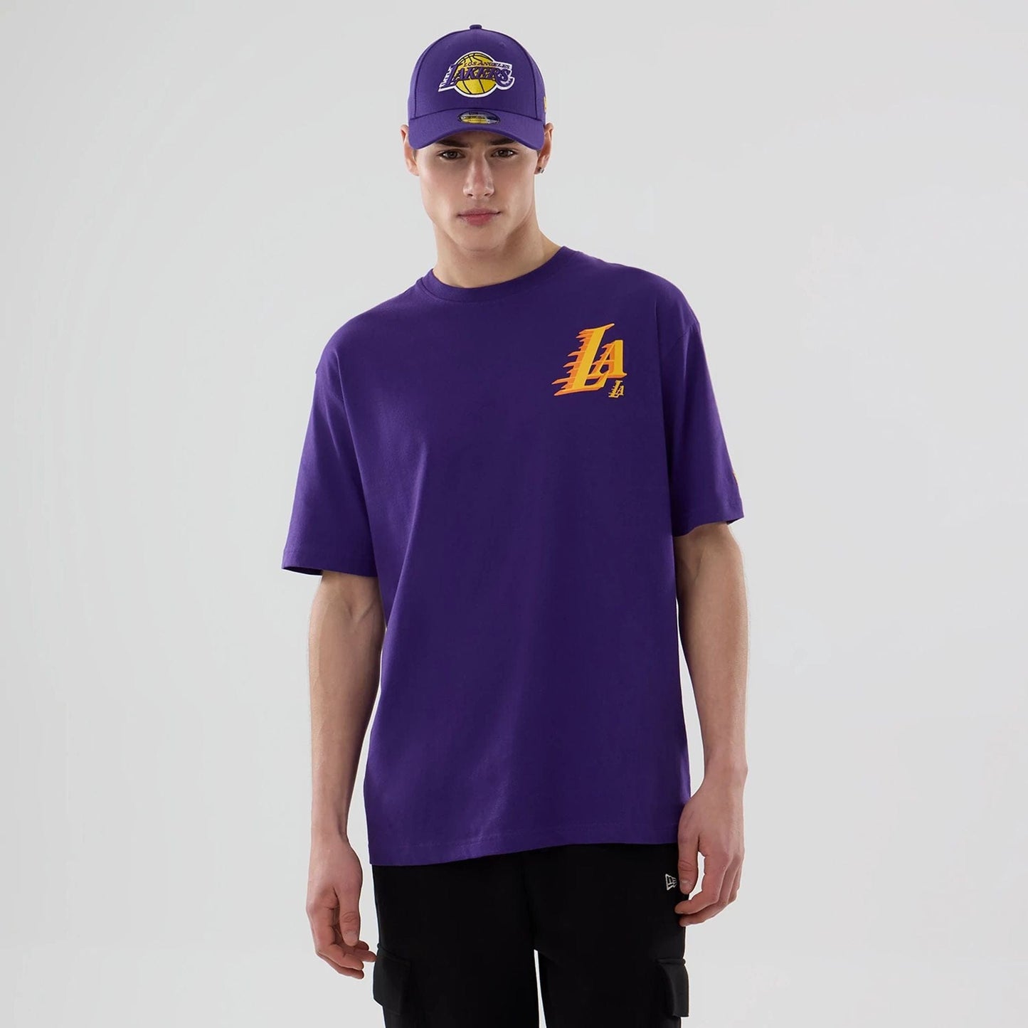 The model is wearing this NBA Graphic LA Lakers T-Shirt in purple. 1