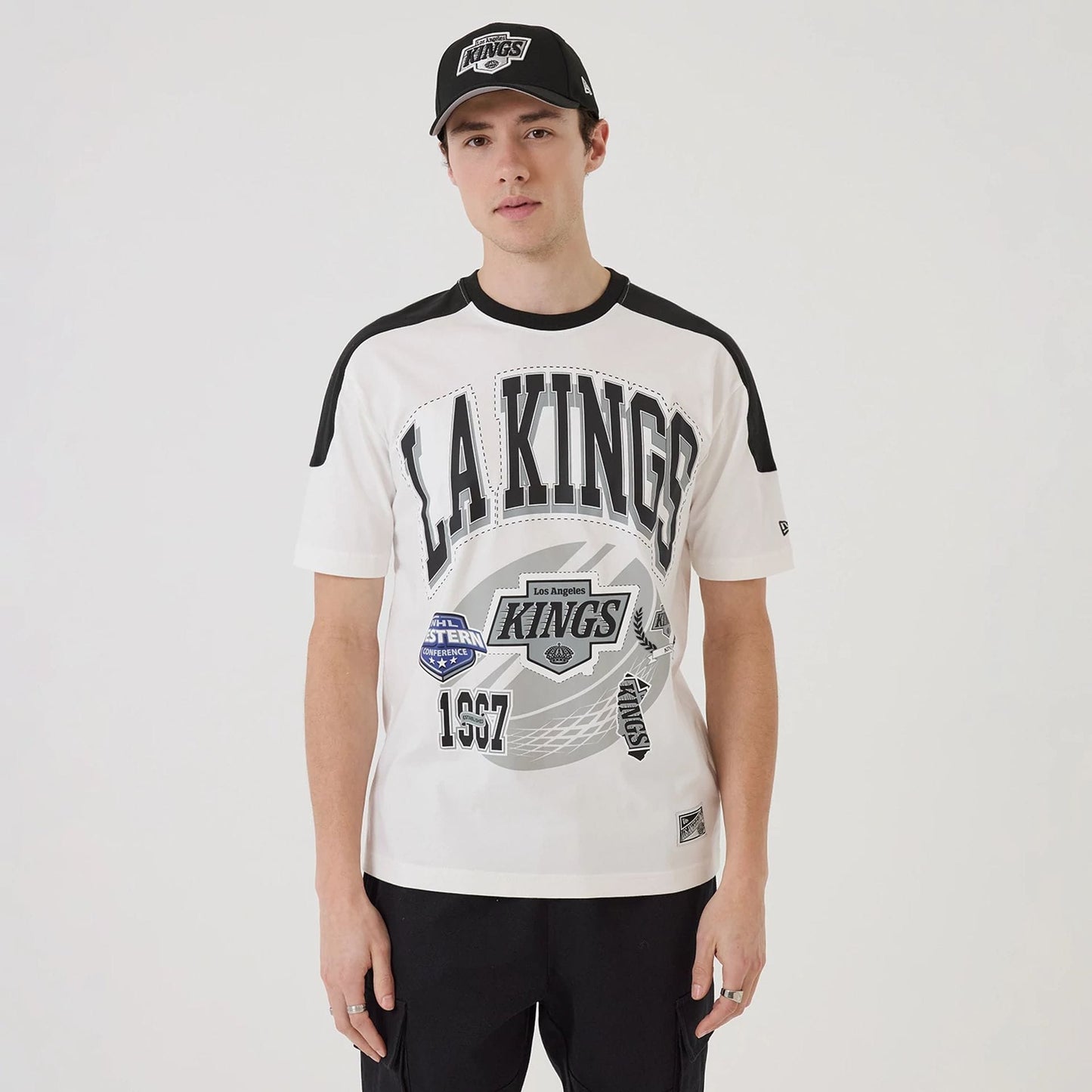 The model is wearing this NHL Sport Classic LA Kings T-Shirt in white. 1