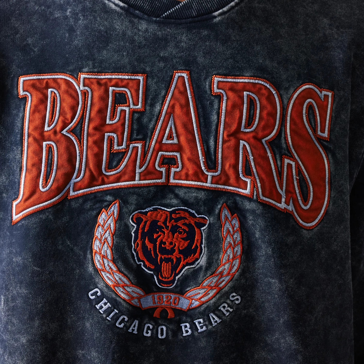 The model is wearing this NFL Chicago Bears Crew Neck Sweater in navy. 3