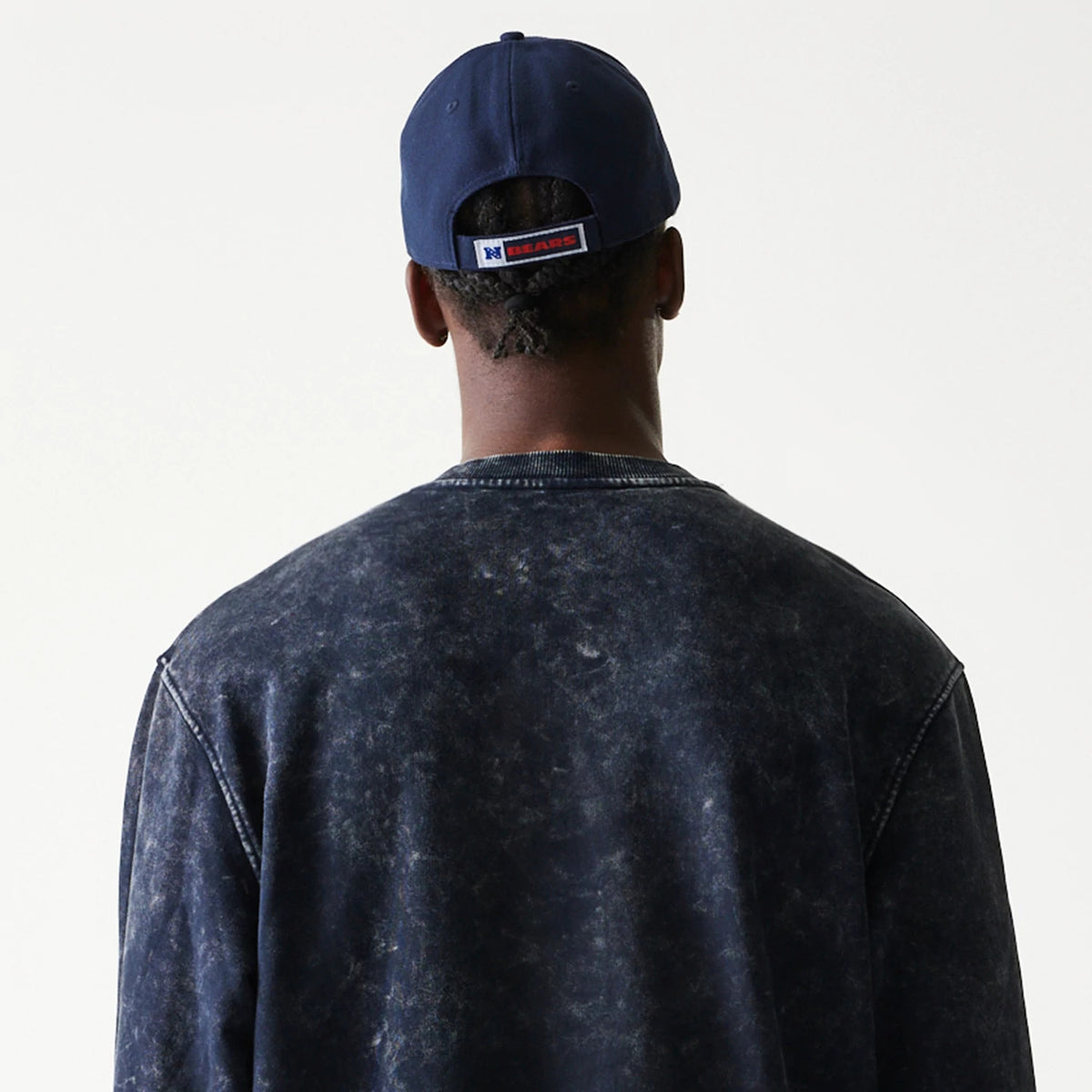 The model is wearing this NFL Chicago Bears Crew Neck Sweater in navy. 8