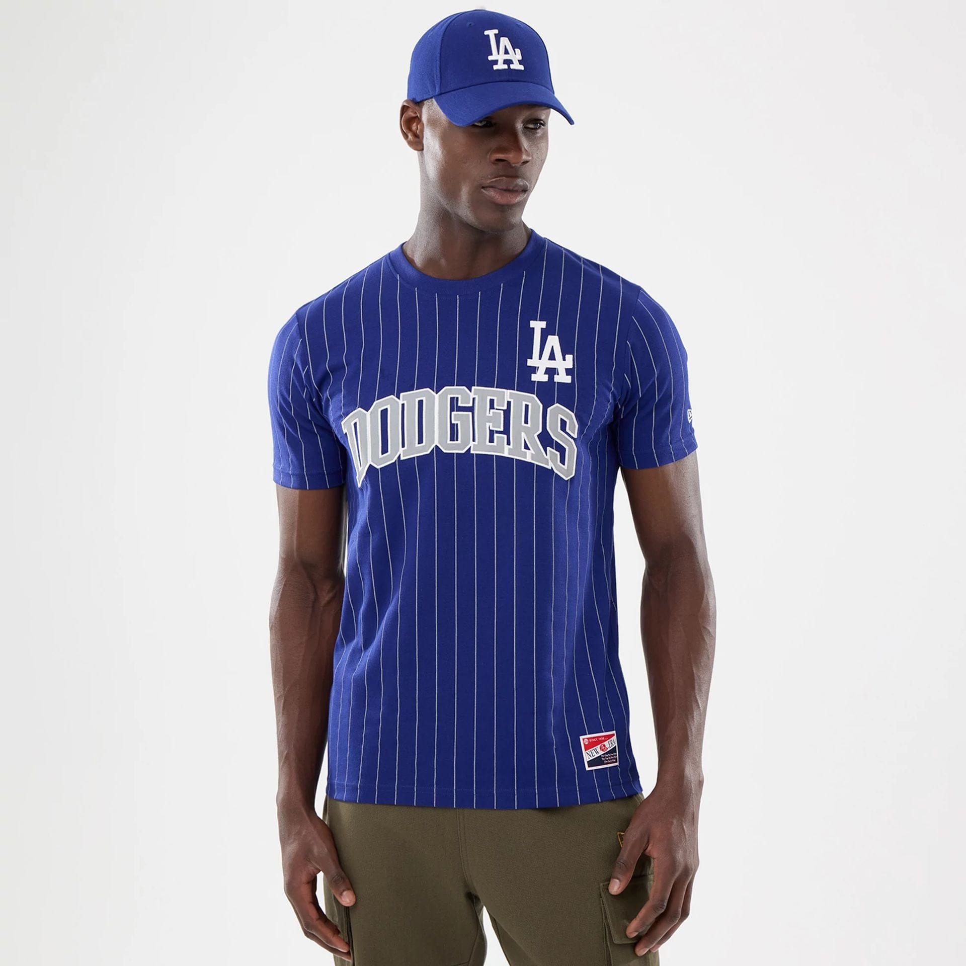 The model is wearing this MLB Pinstripe LA Dodgers T-Shirt in dark blue. 1