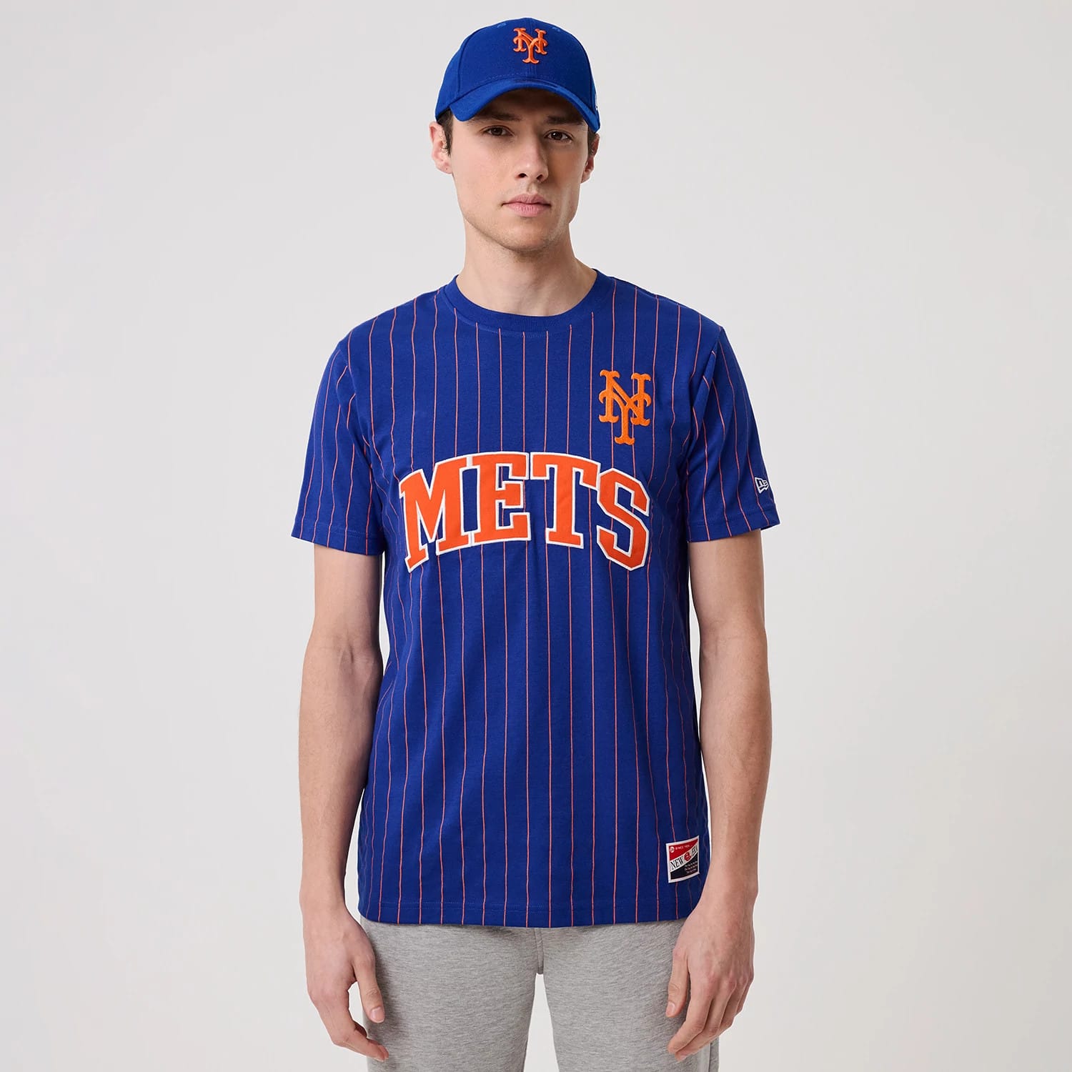 The model is wearing this MLB Pinstripe New York Mets T-Shirt in blue. 1
