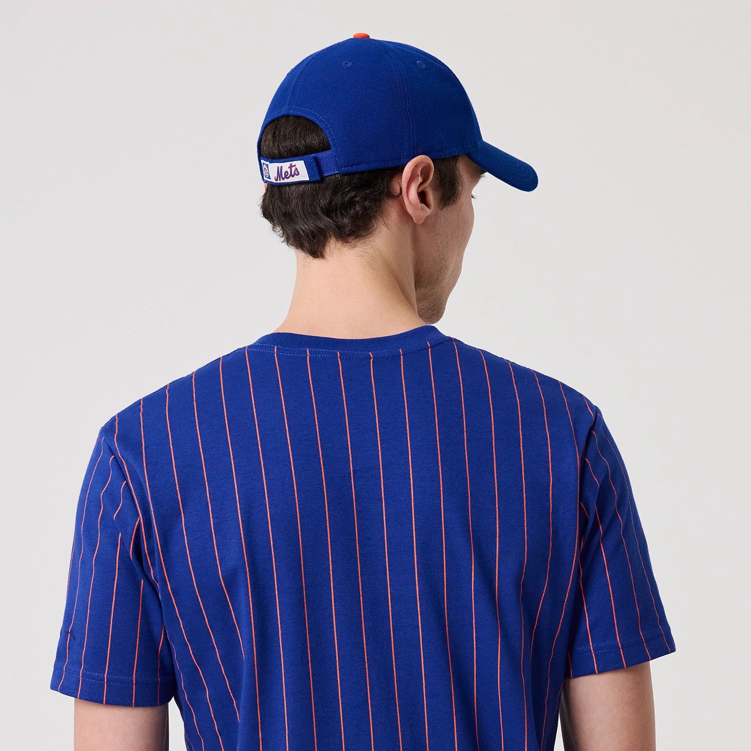 The model is wearing this MLB Pinstripe New York Mets T-Shirt in blue. 6