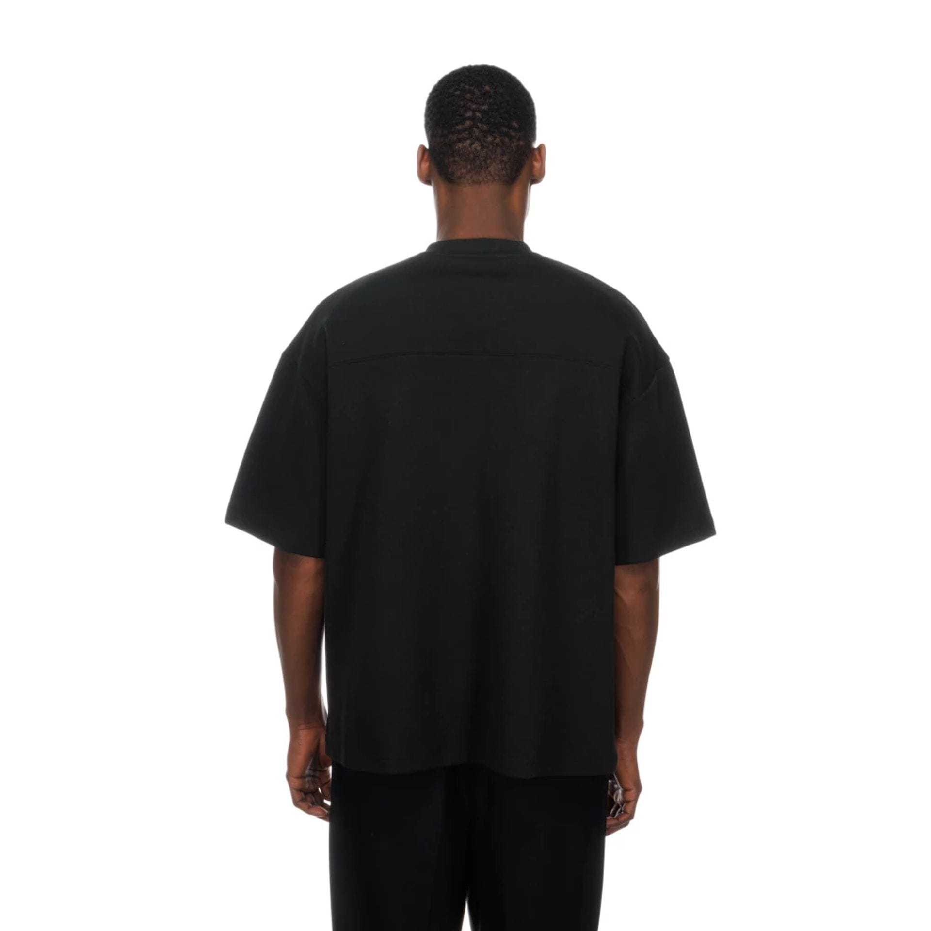 The model is wearing this NFL Las Vegas Raiders Boxy T-Shirt in black. 2
