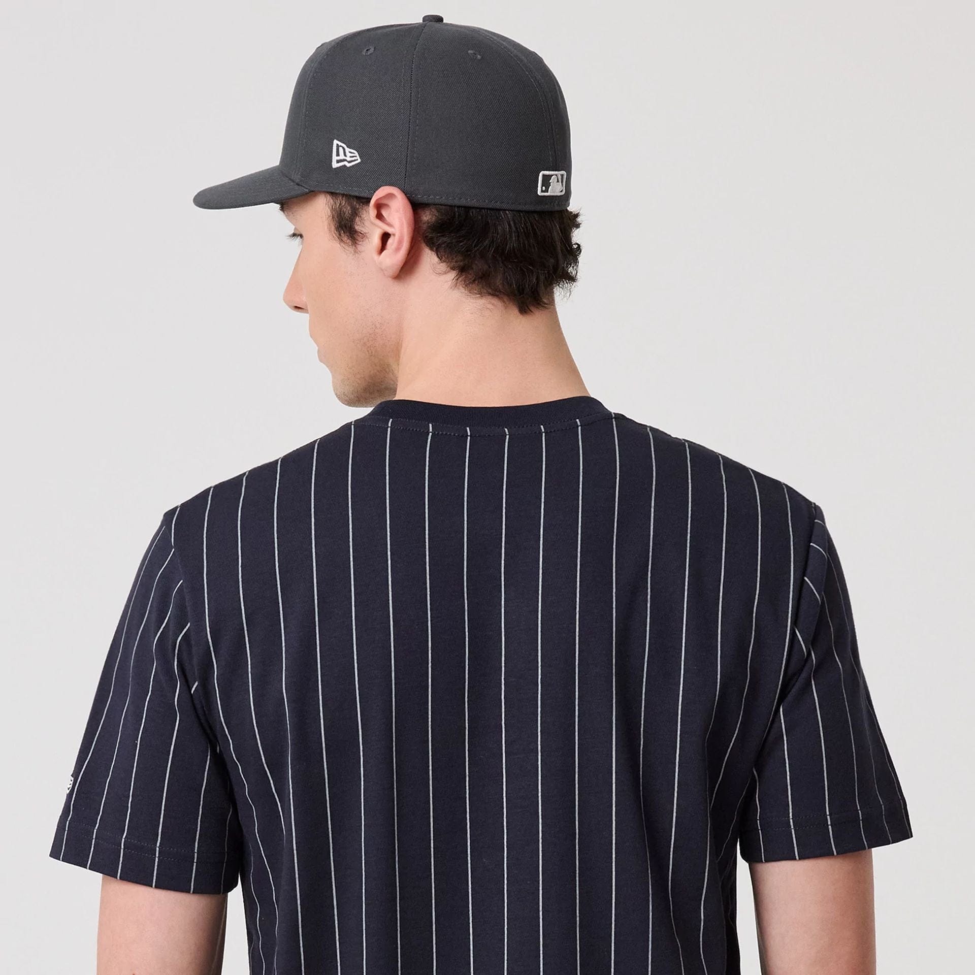 The model is wearing this MLB Pinstripe New York Yankees T-Shirt in navy. 7