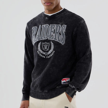 The model is wearing this NFL Las Vegas Raiders Crew Neck Sweater in black. 4