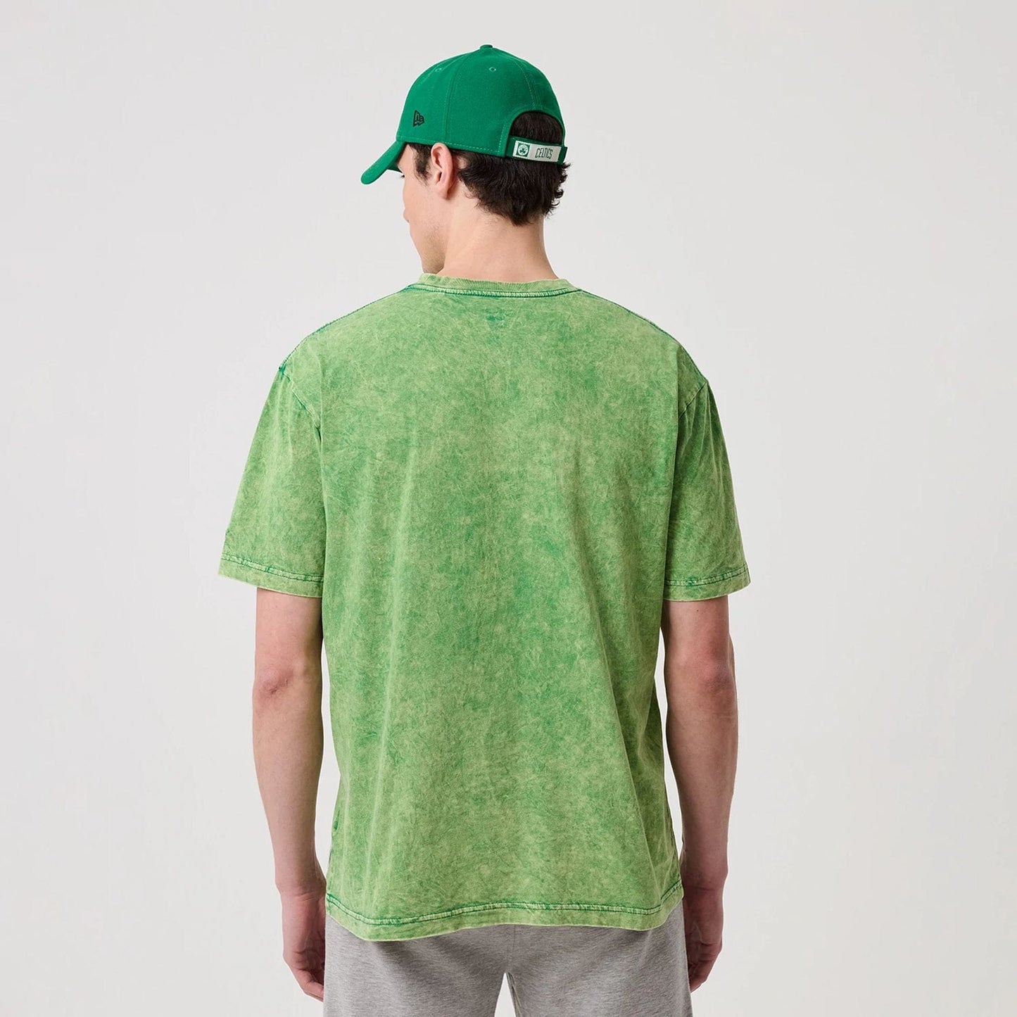 The model is wearing this NBA Boston Celtics T-Shirt in green. 2