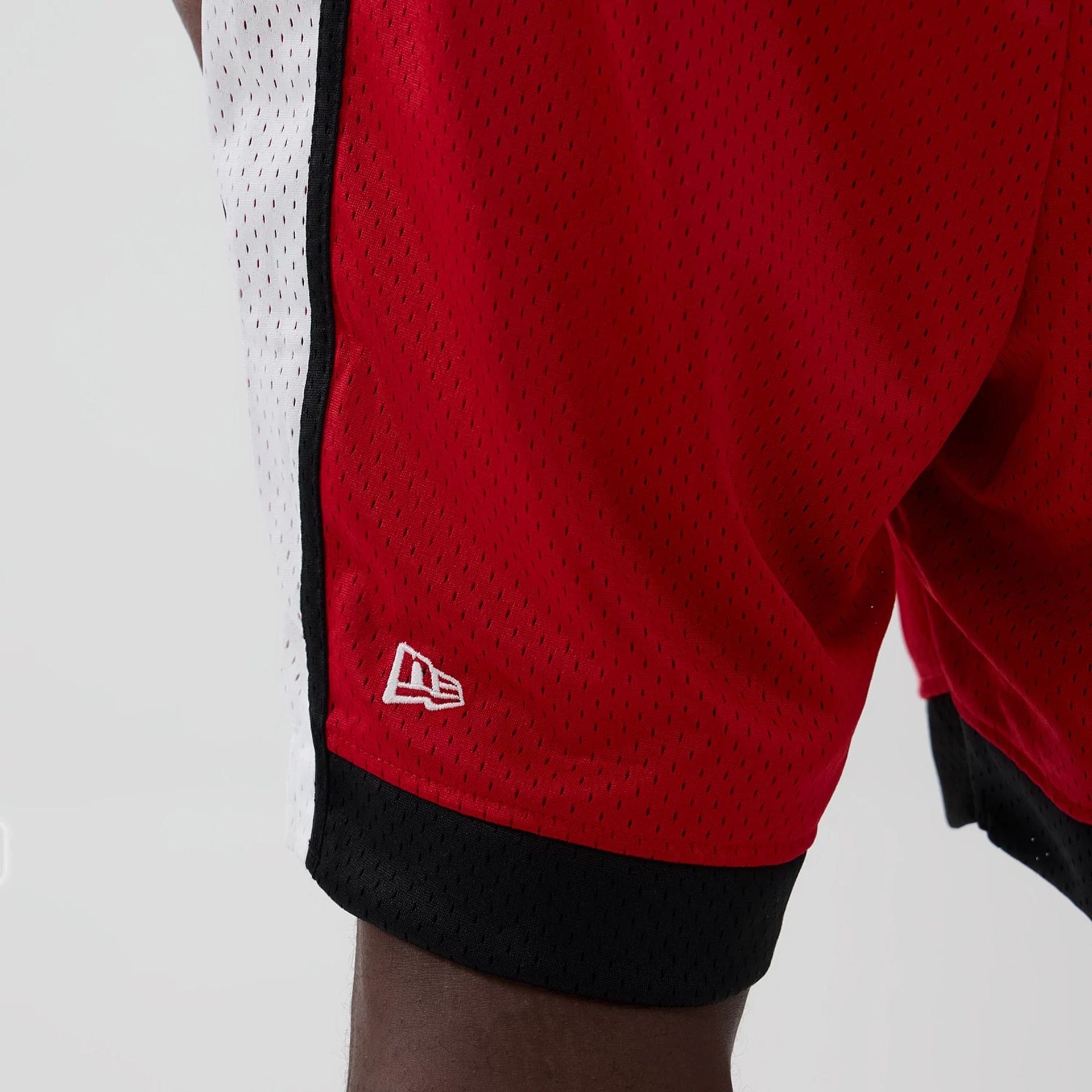 The model is wearing these NFL Kansas City Chiefs Mesh Shorts in red. 4