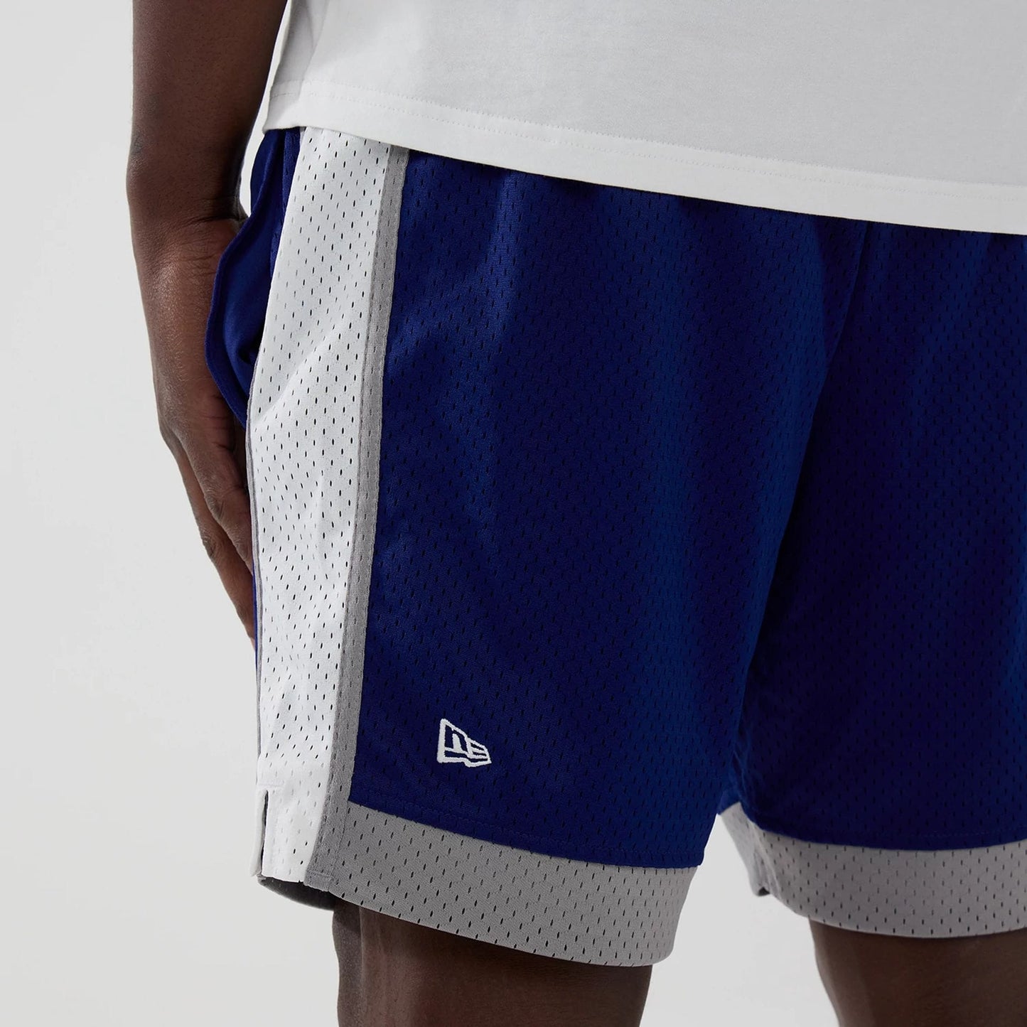 The model is wearing these MLB LA Dodgers Mesh Shorts in dark blue. 3