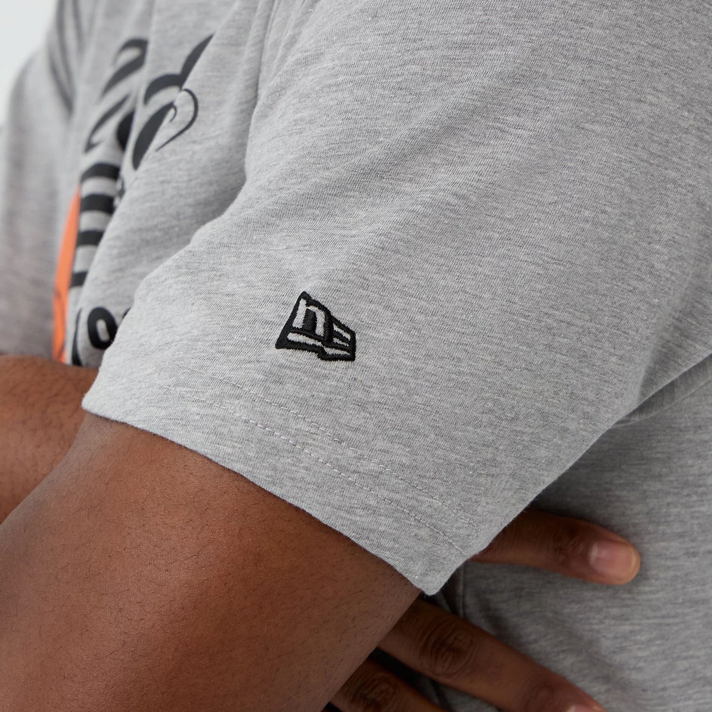 The Male model is wearing  New Era Back To School Grey T-Shirt 5