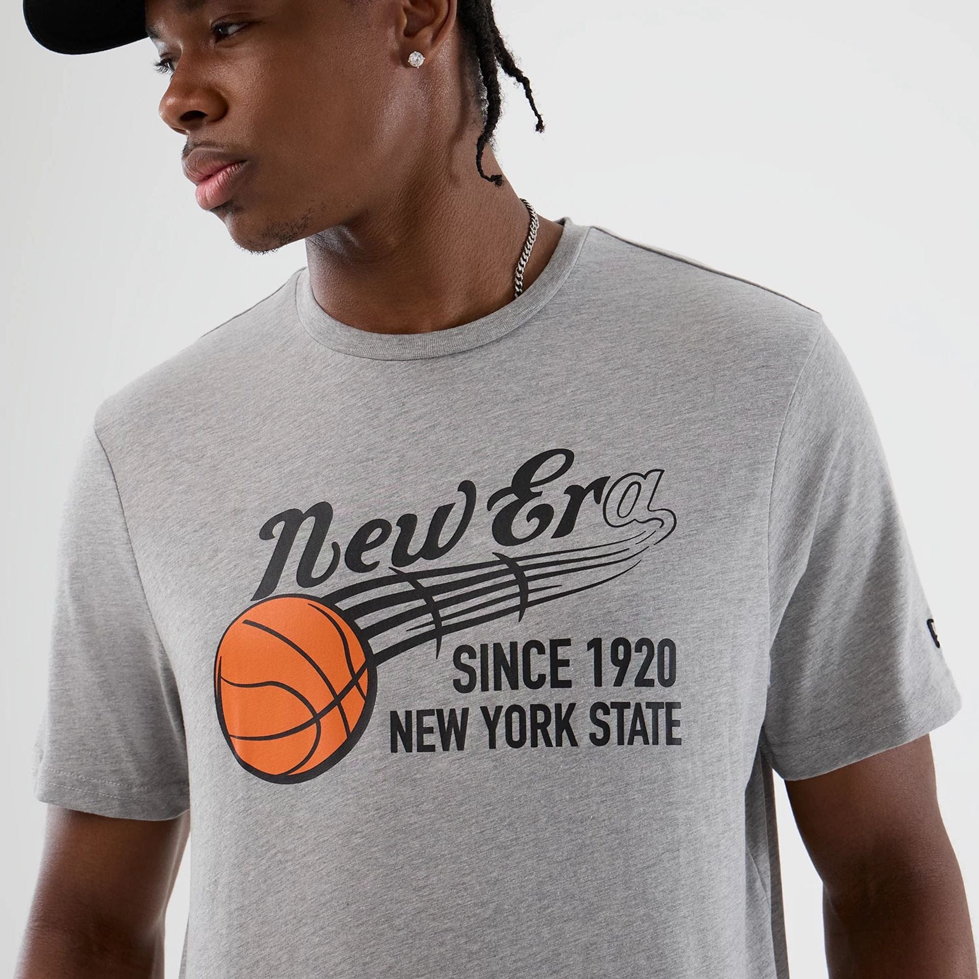The Male model is wearing  New Era Back To School Grey T-Shirt  6