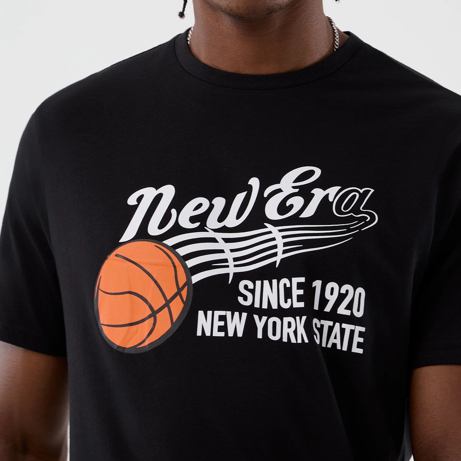 The Male model is wearing  New Era Back To School Black T-Shirt 4