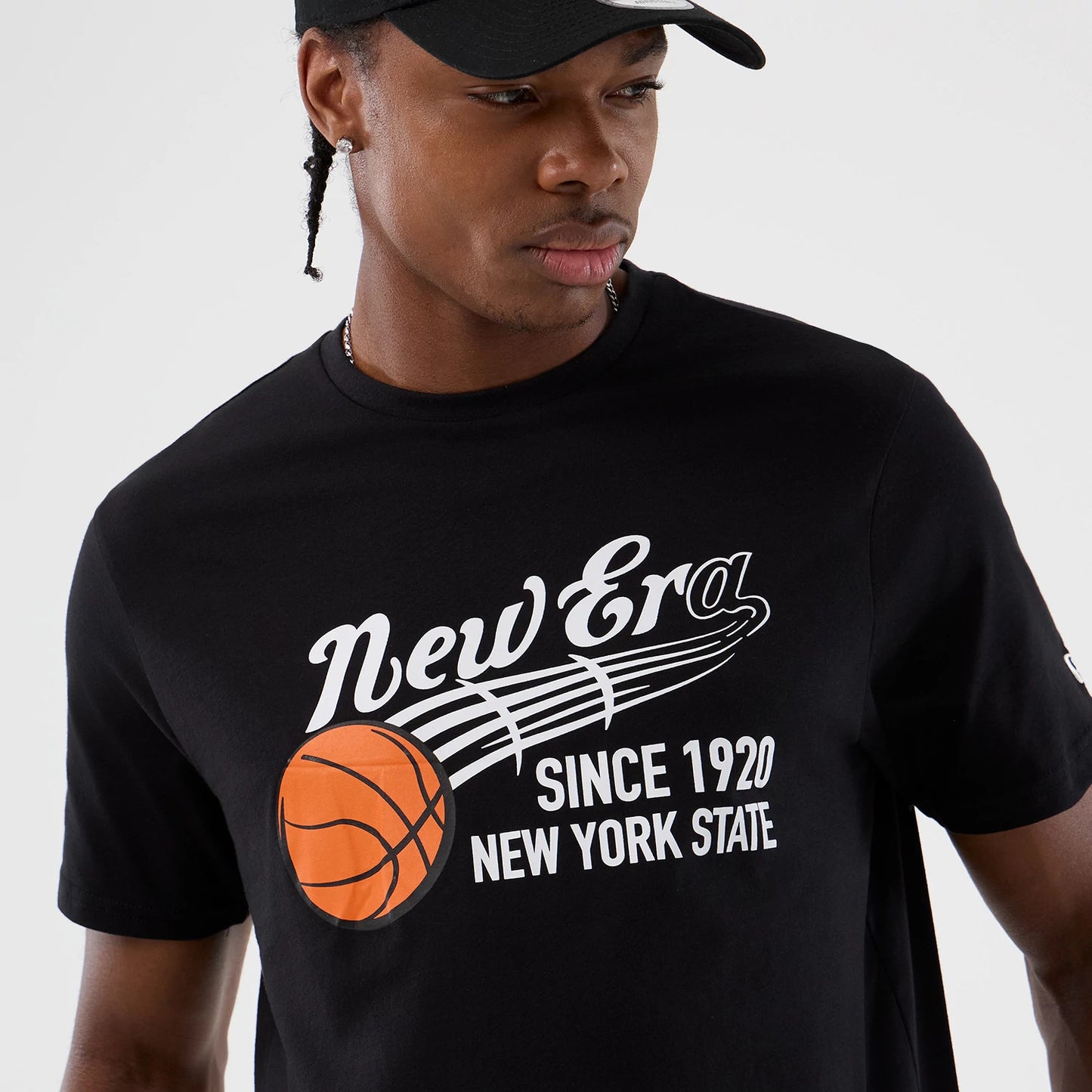 The Male model is wearing  New Era Back To School Black T-Shirt 6