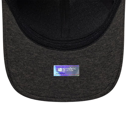 Colorado Rockies MLB Clubhouse Black New Era 39THIRTY Infinity Stretch Fit Cap, inside view showing black taping and sweatband with a sticker on the grey curved undervisor featuring the MLB Authentic Collection logo.