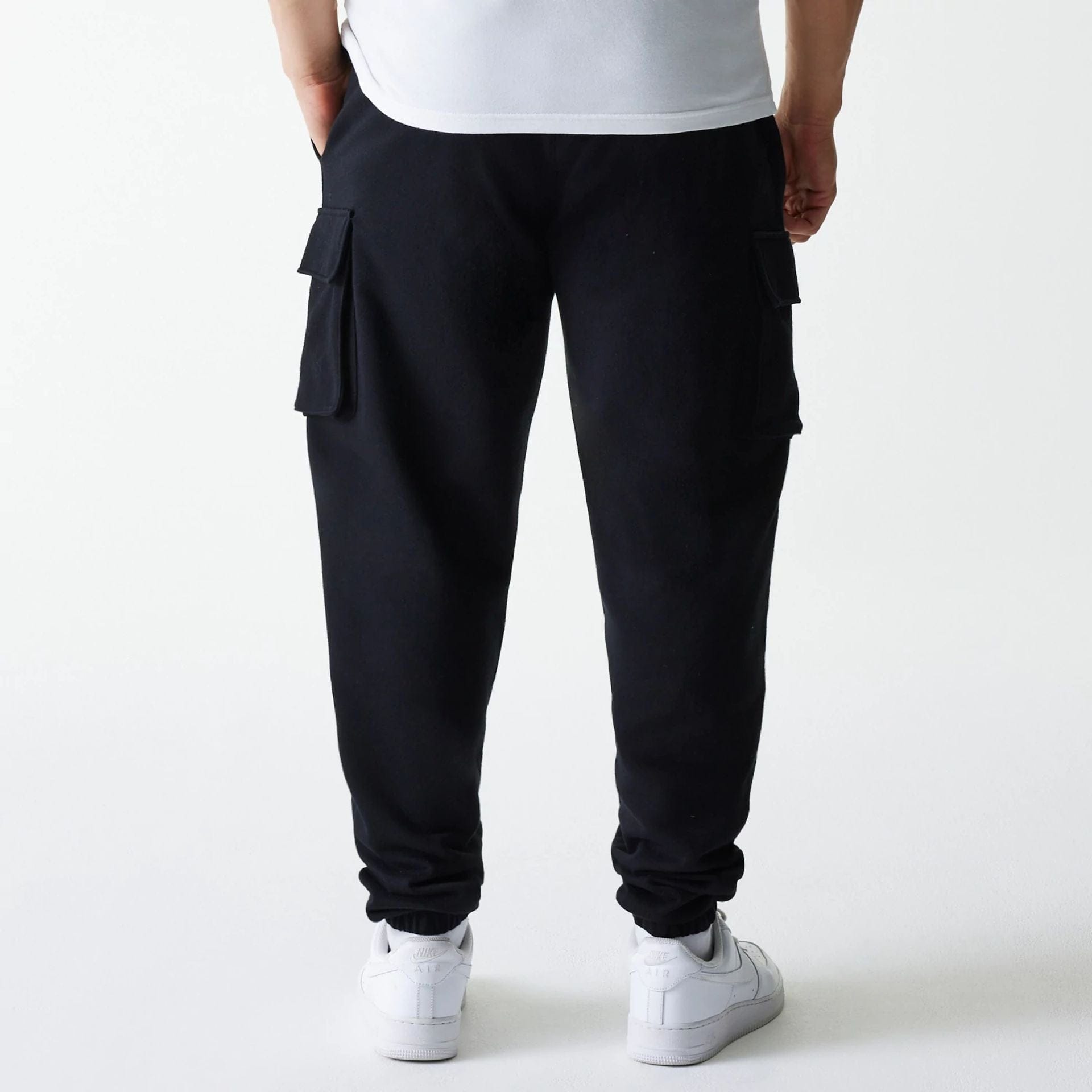 The model is wearing this New Era Cargo Joggers in black. 2