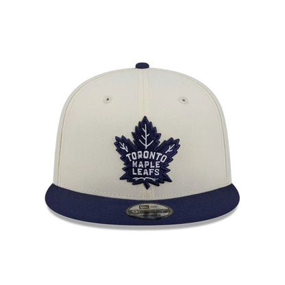 Pictured is this NHL Localized Toronto Maple Leafs 9FIFTY Snapback cap in white. 3