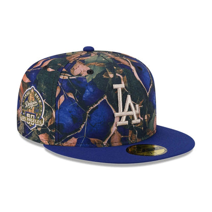 Pictured is this MLB Leaves LA Dodgers 59FIFTY Fitted cap in dark blue. 1