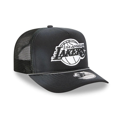 LA Lakers NBA Washed Black New Era 9FIFTY A-Frame Trucker Adjustable Cap, three-quarter view showing the raised white and black embroidered Lakers graphic on the front panel, black mesh sides, and a 9FIFTY size sticker on the black flat visor.