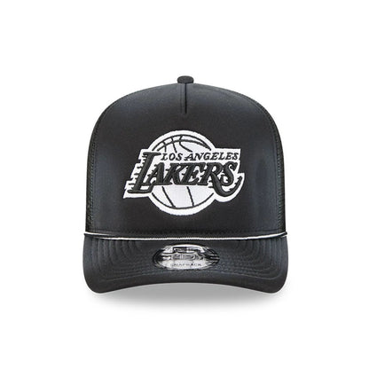 LA Lakers NBA Washed Black New Era 9FIFTY A-Frame Trucker Adjustable Cap, front view showing raised white and black embroidered Lakers text with basketball graphic on the front panel, flat black visor with grey 9FIFTY size sticker.